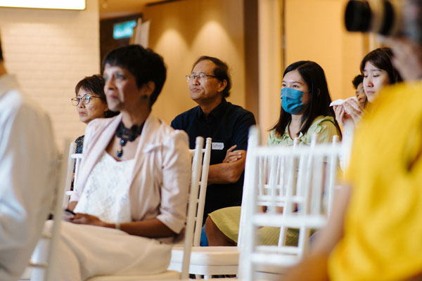 group-of-audience-attending-conference-at-clever-desk